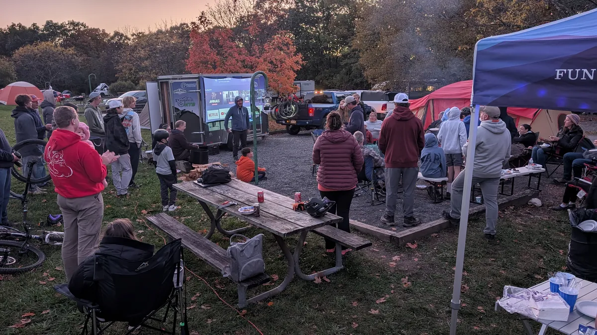 Families and teammates gather at the team campsite after a day of riding.